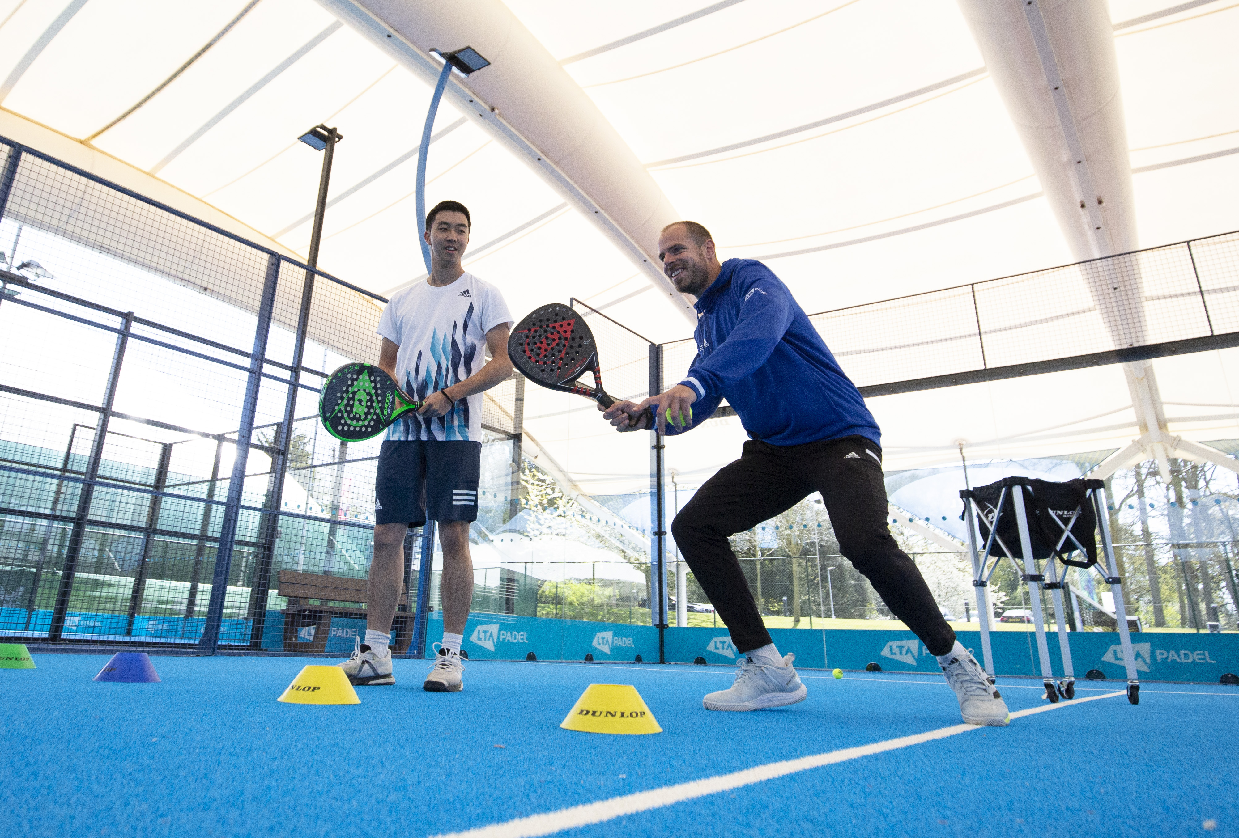 padel-coach-teaching-man-forehand.jpg