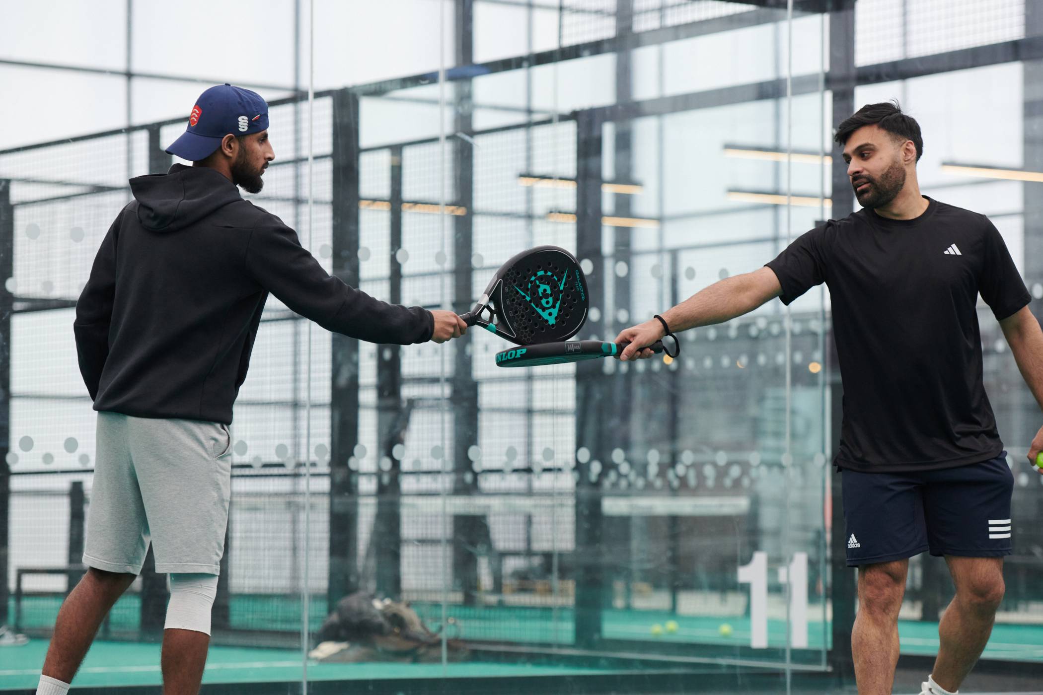 Doubles team-touching-rackets.jpg